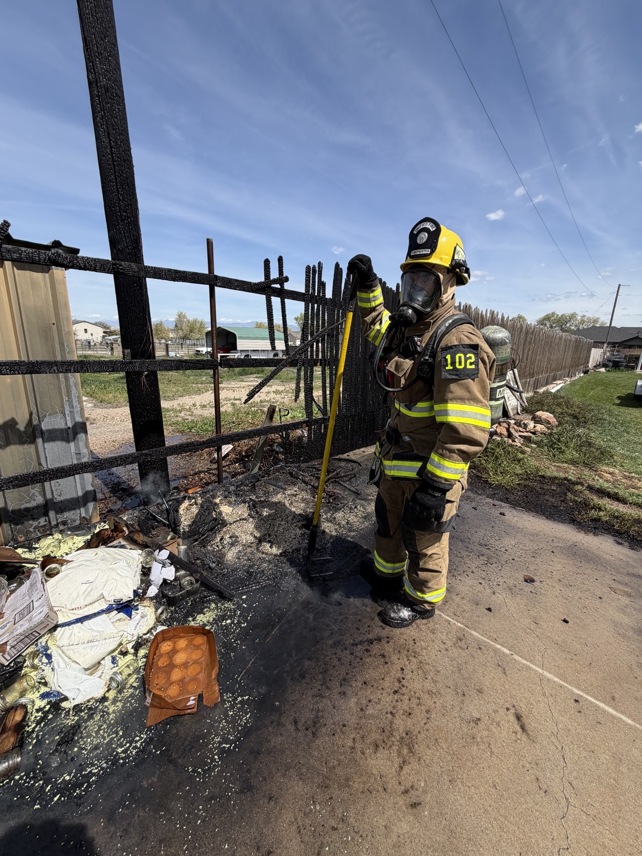 Jordan in full firefighter gear on scene with Engine 102